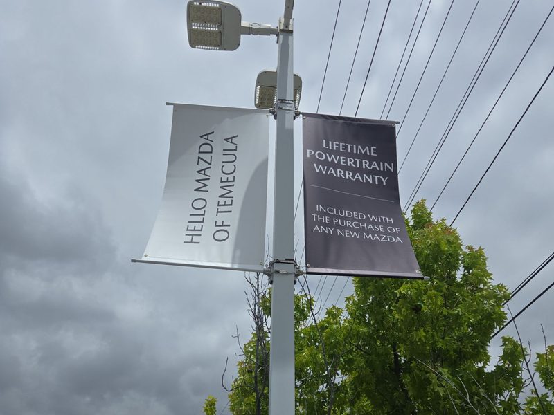 Street pole banners for Hello Mazda of Temecula mounted on a light pole
