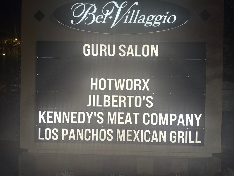 Illuminated multi-tenant directory sign at Bel Villaggio lit at night