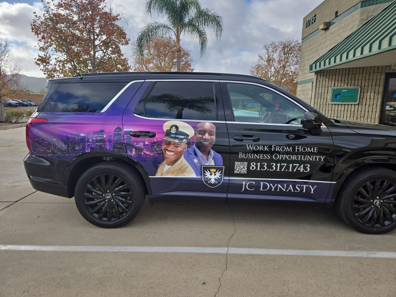 Full-colour vehicle graphics covering the side panels of a JC Dynasty SUV by Signarama Temecula